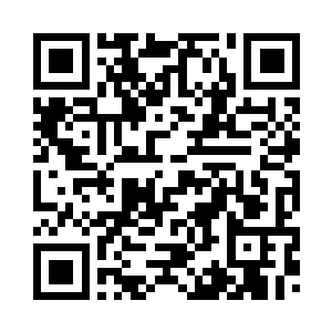 露出一块青石雕刻的仰卧磐龙礅子二维码生成